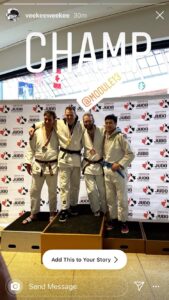Four judoka standing on a podium at the Edmonton International Tournament. JR wearing bronze. 